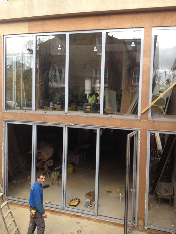 Aluminium bi-fold doors with two-storey glazing in Bletchley