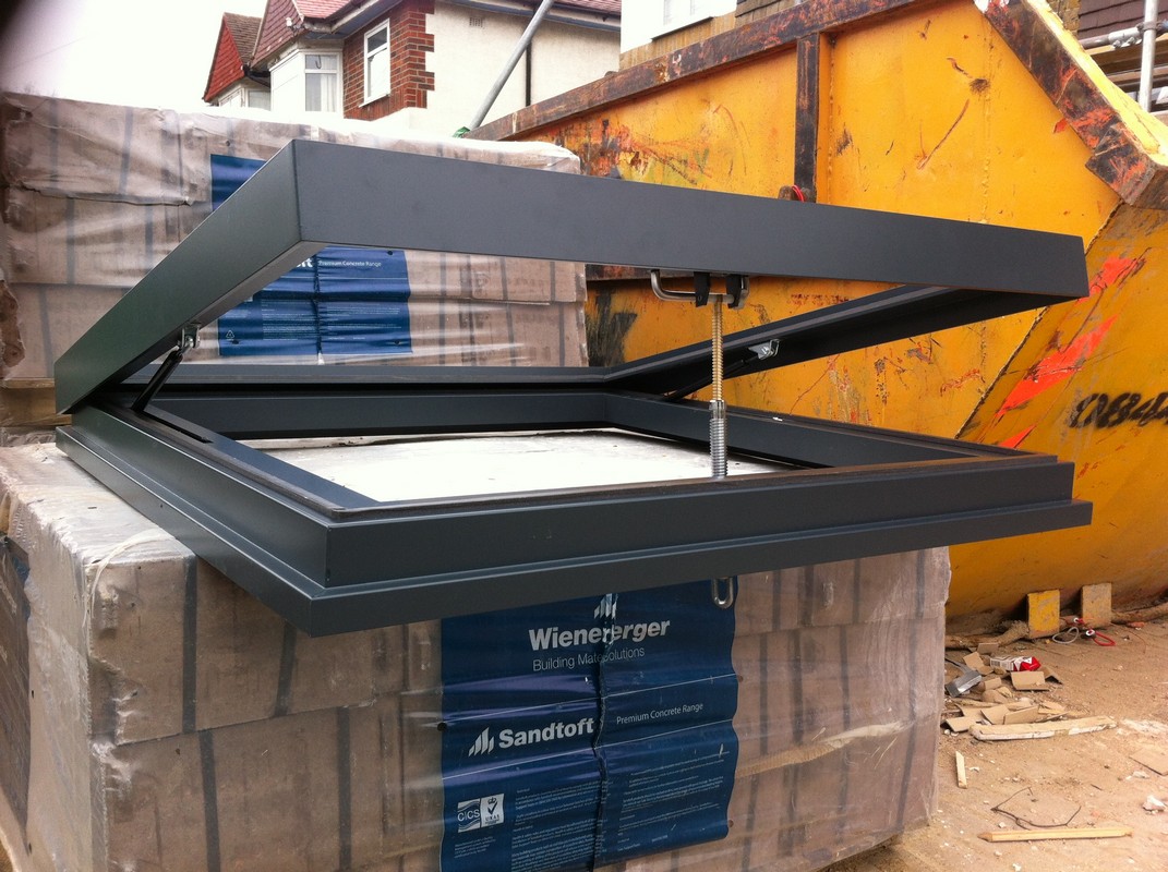 Opening flat roof skylight in anthracite grey installed in Bletchley